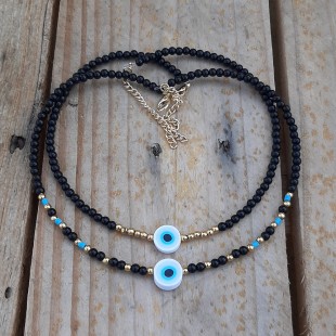 Black pearls with rubber evil eye.