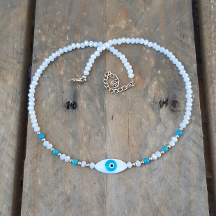 Glossy white crystals with evil eye shape and turquoise stones.
